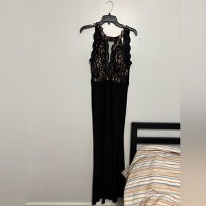 Worn once. Black lace v neck gown.